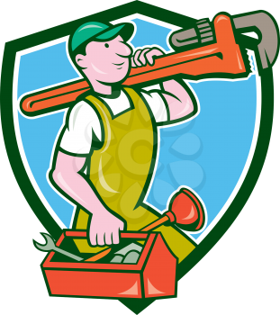 Illustration of a plumber in overalls and hat holding monkey wrench on shoulder and carrying toolbox viewed from the side set inside shield crest on isolated background done in cartoon style. 