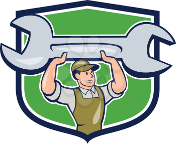 Illustration of a mechanic wearing hat and overalls looking to the side lifting giant spanner wrench viewed from front set inside shield crest on isolated background done in cartoon style. 