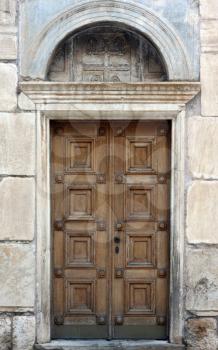 Royalty Free Photo of the Antique Side Door of St. Eleftherios Orthodox Church in Athens, Greece