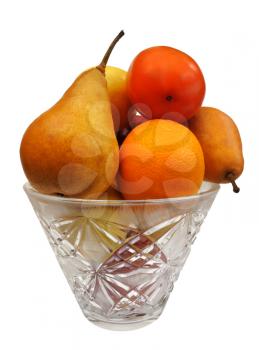 Various fruit in a glass vase on a white background, isolated