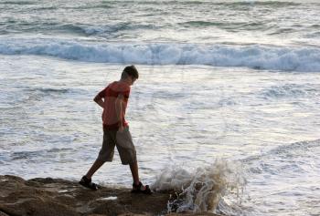 Boy on the shore of the Mediterranean Sea in Israel