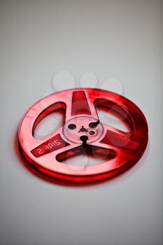 Royalty Free Photo of a Red Plastic Audio Reel