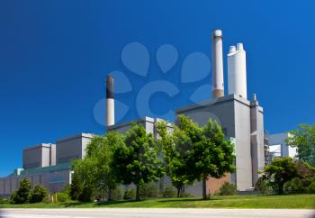 Coal fueled electricity power plant generation station building with smokestack perspective view