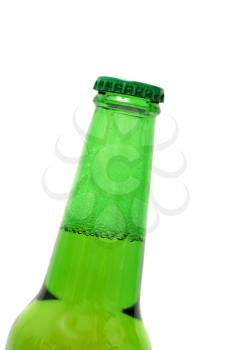 Closeup of a green beer bottle cap and neck  Bottle is at an angle focus on the bottle cap. Shallow Depth of Field.