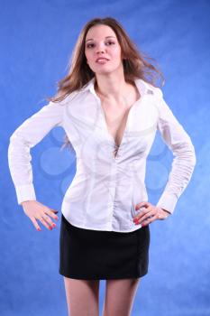 Intelligent looking female. This picture is taken in a studio on blue