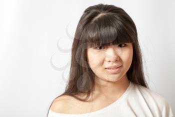 Portrait of asian woman. Casual woman portrait of young smiling girl with long black hair and clean skin over white