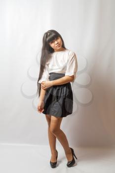 Young asian student. Beautiful young woman. Portrait of asian woman in black skirt