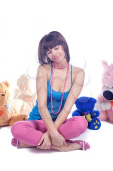 Beautiful girl posing with teddy bear over white background