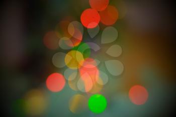 Mist bokeh defocused christmaslights. Many celebration garlan lights defocused on colorful background