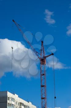 Royalty Free Photo of a Crane and Building Under Construction 