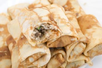 Royalty Free Photo of Crepes Filled With Meat and Rice