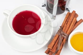 Cup of tea from blueberry and chabrets with cinnamon sticks, and honey