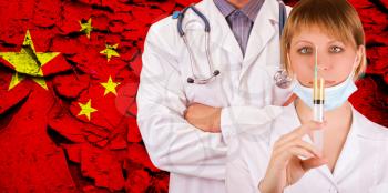 Male and female doctor on China flag background. Concept of corona virus.