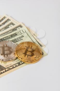 Bitcoin coin with dollars on the white background