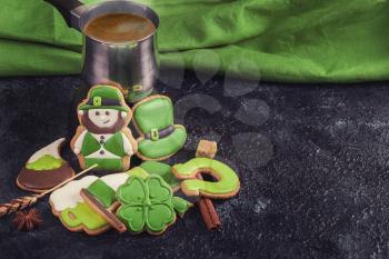 Gingerbreads for Patrick's day and on wooden background