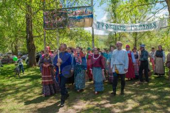 TOPOLNOE, ALTAY, RUSSIA - May 27, 2018: Folk festivities dedicated to the feast of the Holy Trinity. Ancient Russian rite: procession with a birch for its further sinking.