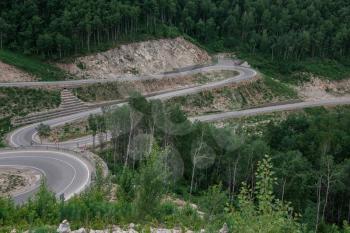 Winding road in the mountains, drone shot. Altai Krai, Western Siberia, Russia. Road to Resort town Belokurikha 2