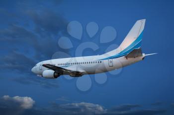 Large passenger plane flying in the blue sky