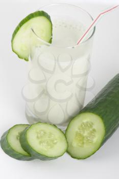 green cucumber coctail with kefir on white