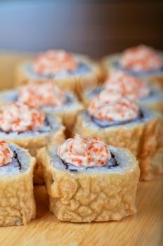 Sushi roll with fresh cream cheese and tobico