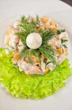 Salad from chicken breast, vegetable, mayoneese and quail egg