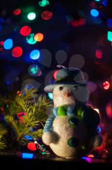 New year bokeh background with snowman