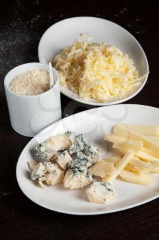 different cheese at white plate