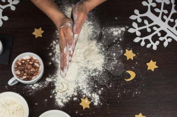 ready for dough by hands on wooden table background