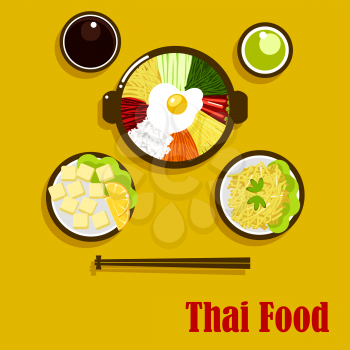 Individual dishes of thai cuisine with fried egg, served in a big bowl with vegetables sticks and rice, soy and green chilli sauces, fried sweet potatoes and coconut dessert with oranges