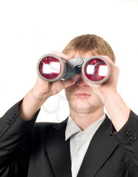 Businessman with binoculars searching for something isolated over white