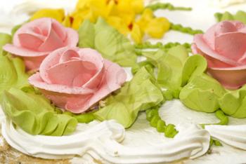 Dessert - Close-up of cake with cream, pink roses and green leaves