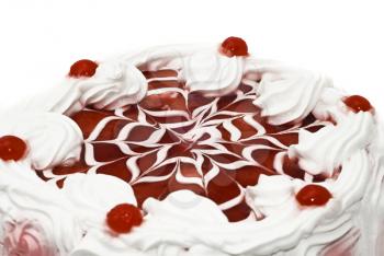 Sweet dessert - iced cake with cherries and beautiful red pattern