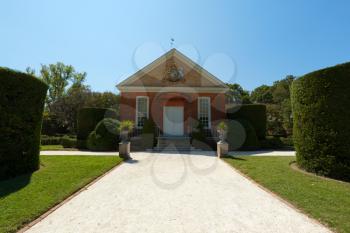 Royalty Free Photo of a Small Building on Landscaped Grounds