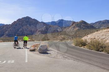 Bicyclists traveling in the  Mojave Desert.