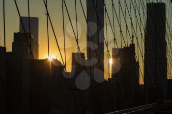 Bright lights of New York City at sunset.