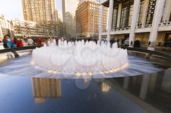 New York City, USA-April 2, 2017: View of Lincoln Center's Revson Fountain, probably the most recognizable destination for visitors and locals.