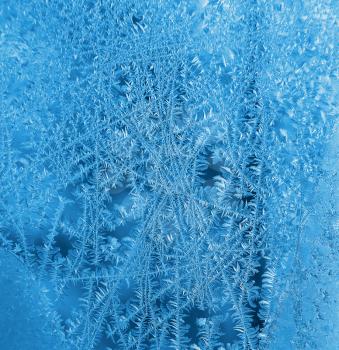 Natural texture of ice pattern on winter glass