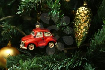 Red car, cone and ball, decorations on faux christmas tree