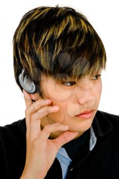 Royalty Free Photo of a Young Male Model Listening to Music on Headphones