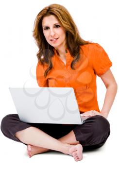 Royalty Free Photo of a Woman Sitting with Her Legs Crossed Holding a Laptop