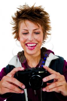 Royalty Free Photo of a Woman Holding a Camera and Smiling
