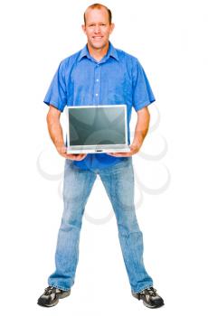 Royalty Free Photo of a Man Standing and Holding a Laptop