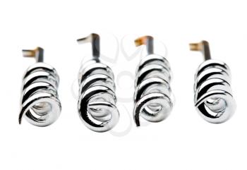 Four shiny corkscrews in an order isolated over white