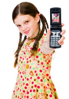 Child showing a mobile phone and smiling isolated over white
