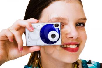 Caucasian girl holding a camera and photographing isolated over white