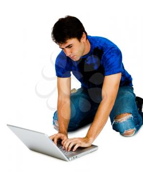 Man using a laptop and posing isolated over white