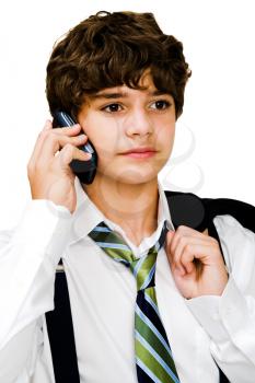 Caucasian boy talking on a mobile phone isolated over white