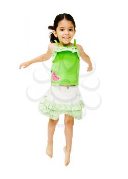 Portrait of a girl jumping and smiling isolated over white