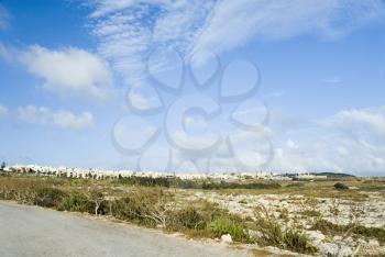 Road with a township in the background, Malta