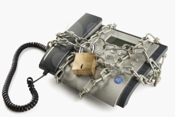 telephone secured with chain and padlock